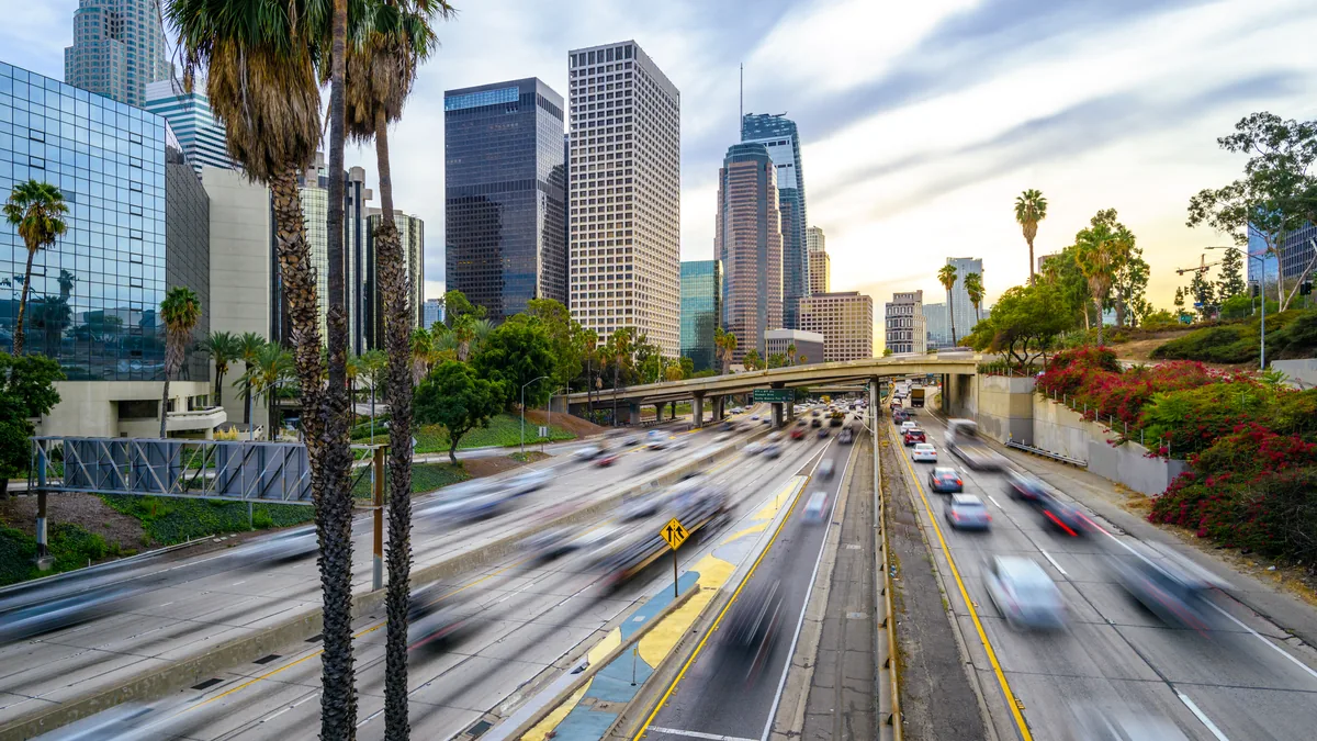 Downtown Los Angeles traffic and skyline at sunset